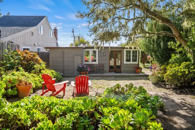 front view of a house with an outdoor seating