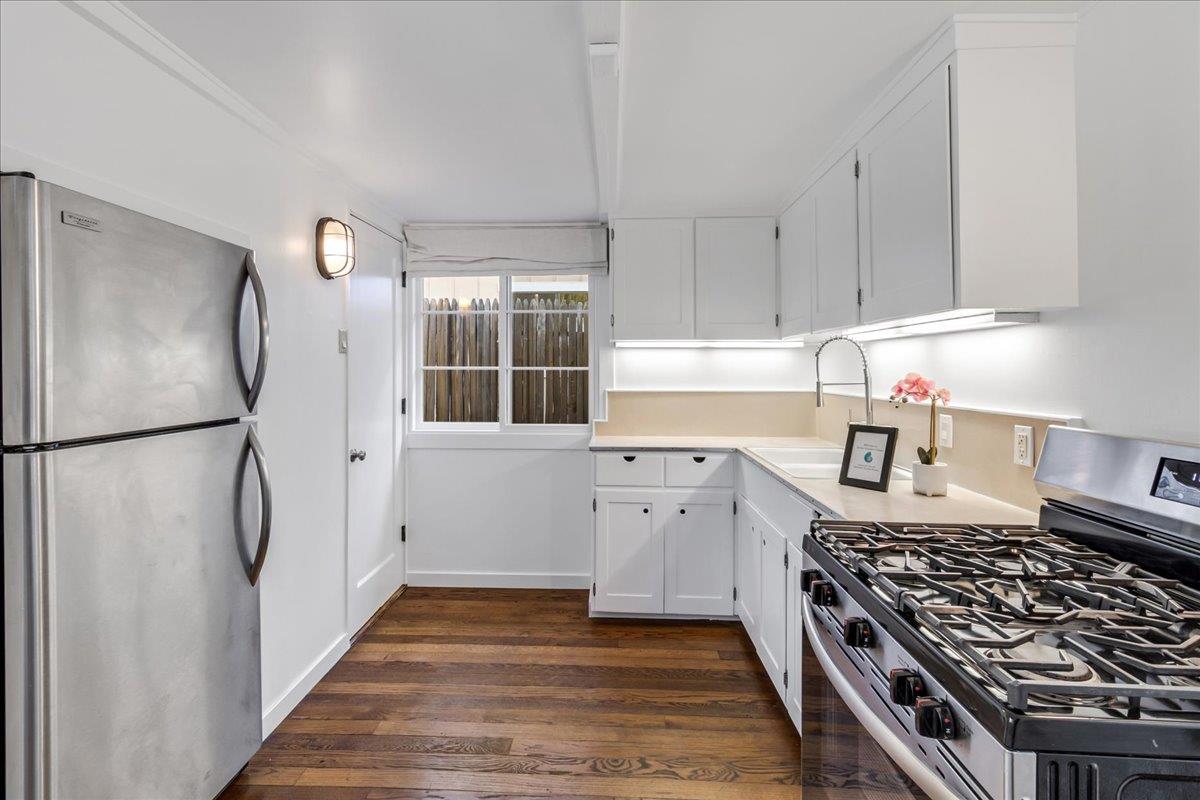 24747 Valley Way Carmel, CA 93923 - Photo 3 of 24 a kitchen with granite countertop a refrigerator and a stove top oven