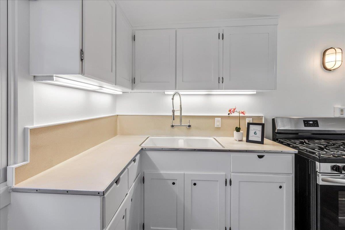 24747 Valley Way Carmel, CA 93923 - Photo 10 of 24 a kitchen with a sink a stove and cabinets
