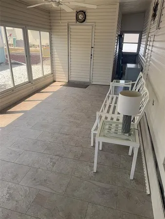a view of staircase with white walls and a rug