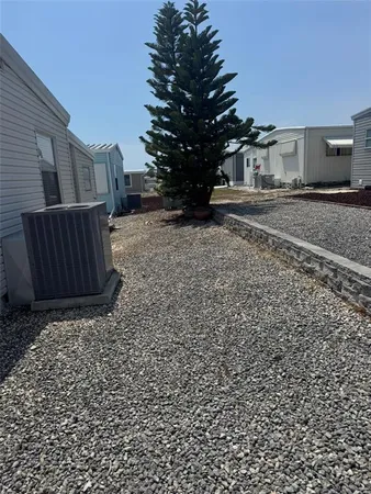 a view of a backyard of the house