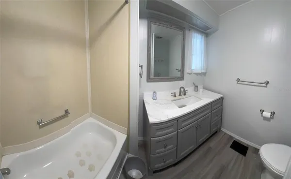 a bathroom with a sink and a toilet