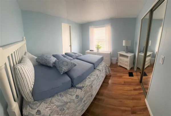 a living room with a bed and a couch