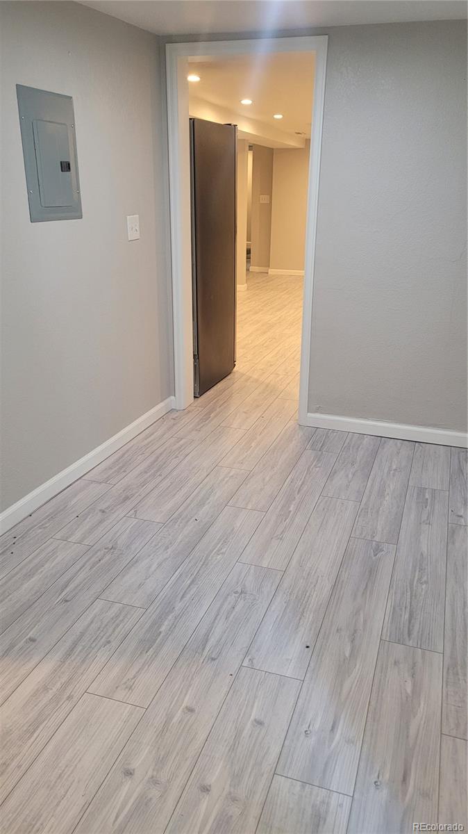 2834 Curtis Street, Unit 3 Denver, CO 80205 - Photo 5 of 22 a view of a hallway with wooden floor