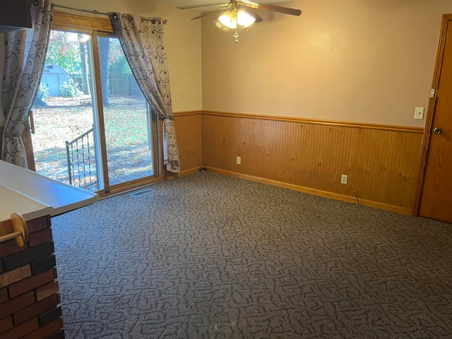 a view of a dining room with furniture window and outside view