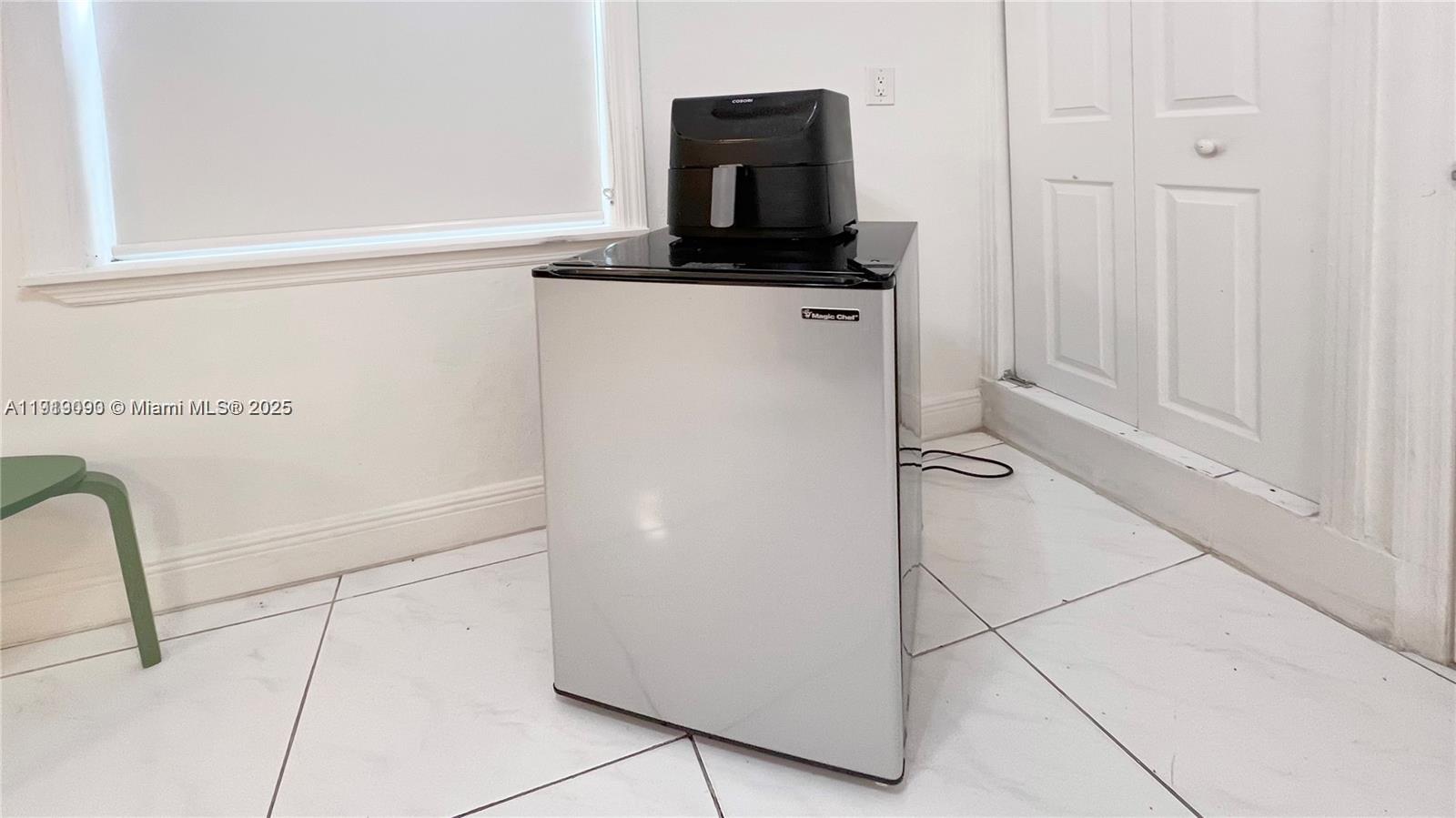 1950 Southwest 5th Street, Unit 2 Miami, FL 33135 - Photo 11 of 11 a kitchen with a refrigerator and a stove
