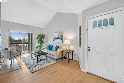 a living room with furniture rug and window
