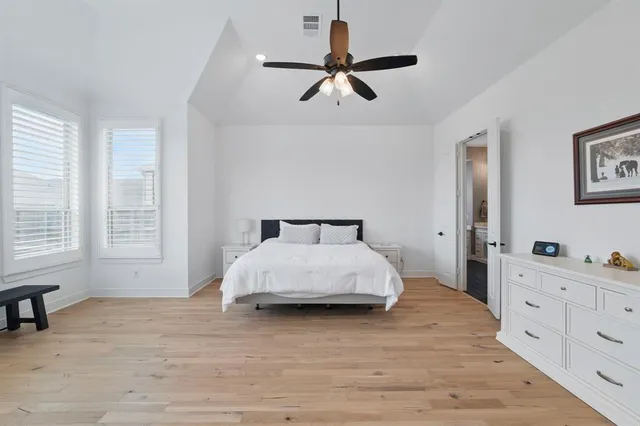 a bedroom with a bed and a dresser