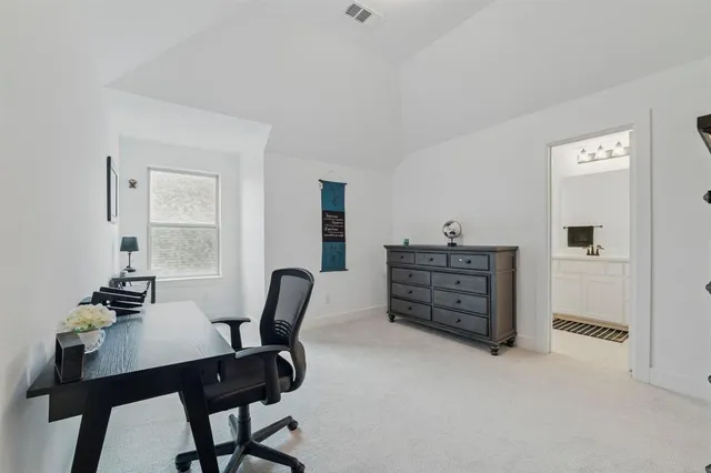 a view of a workspace with furniture