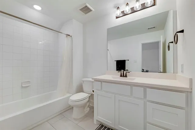 a bathroom with a sink a toilet and a bathtub