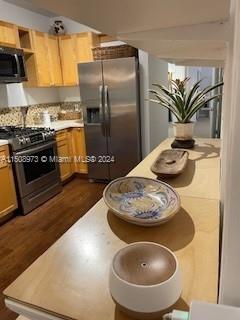 2870 Pine Tree Drive, Unit 2 Miami Beach, FL 33140 - Photo 13 of 36 a kitchen with a refrigerator and a stove