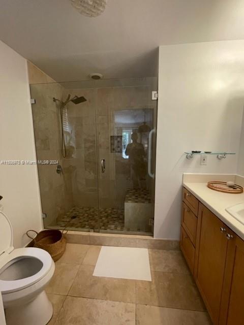 2870 Pine Tree Drive, Unit 2 Miami Beach, FL 33140 - Photo 18 of 36 a bathroom with a granite countertop sink toilet and shower
