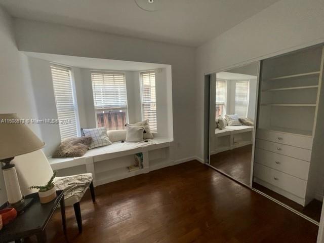 2870 Pine Tree Drive, Unit 2 Miami Beach, FL 33140 - Photo 21 of 36 a room with a bed and a chair