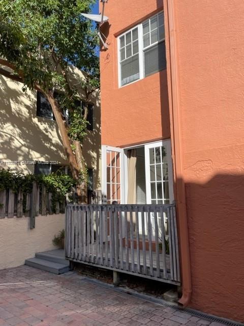 2870 Pine Tree Drive, Unit 2 Miami Beach, FL 33140 - Photo 29 of 36 a view of a house with wooden fence