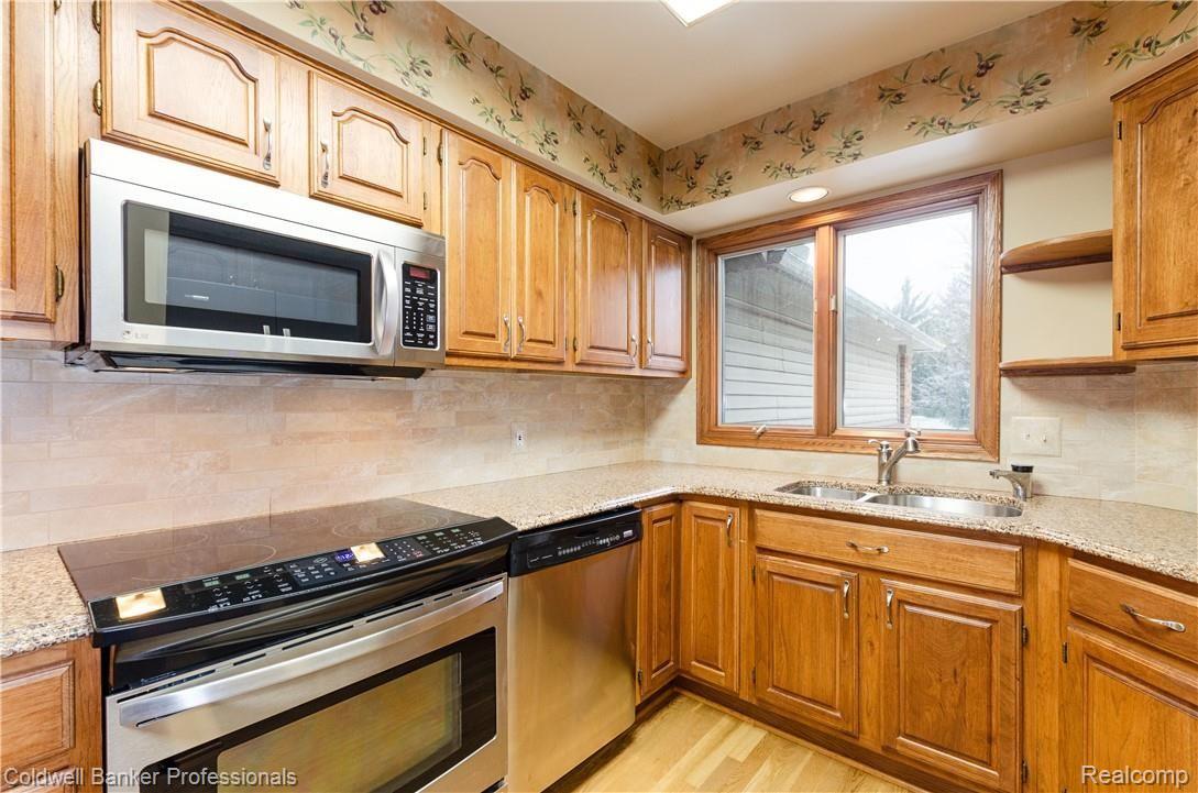 3388 Rivers Edge Drive, Unit 2 Wayne, MI 48184 - Photo 10 of 42 Newer ceramic back splash, granite counters, stainless sink.