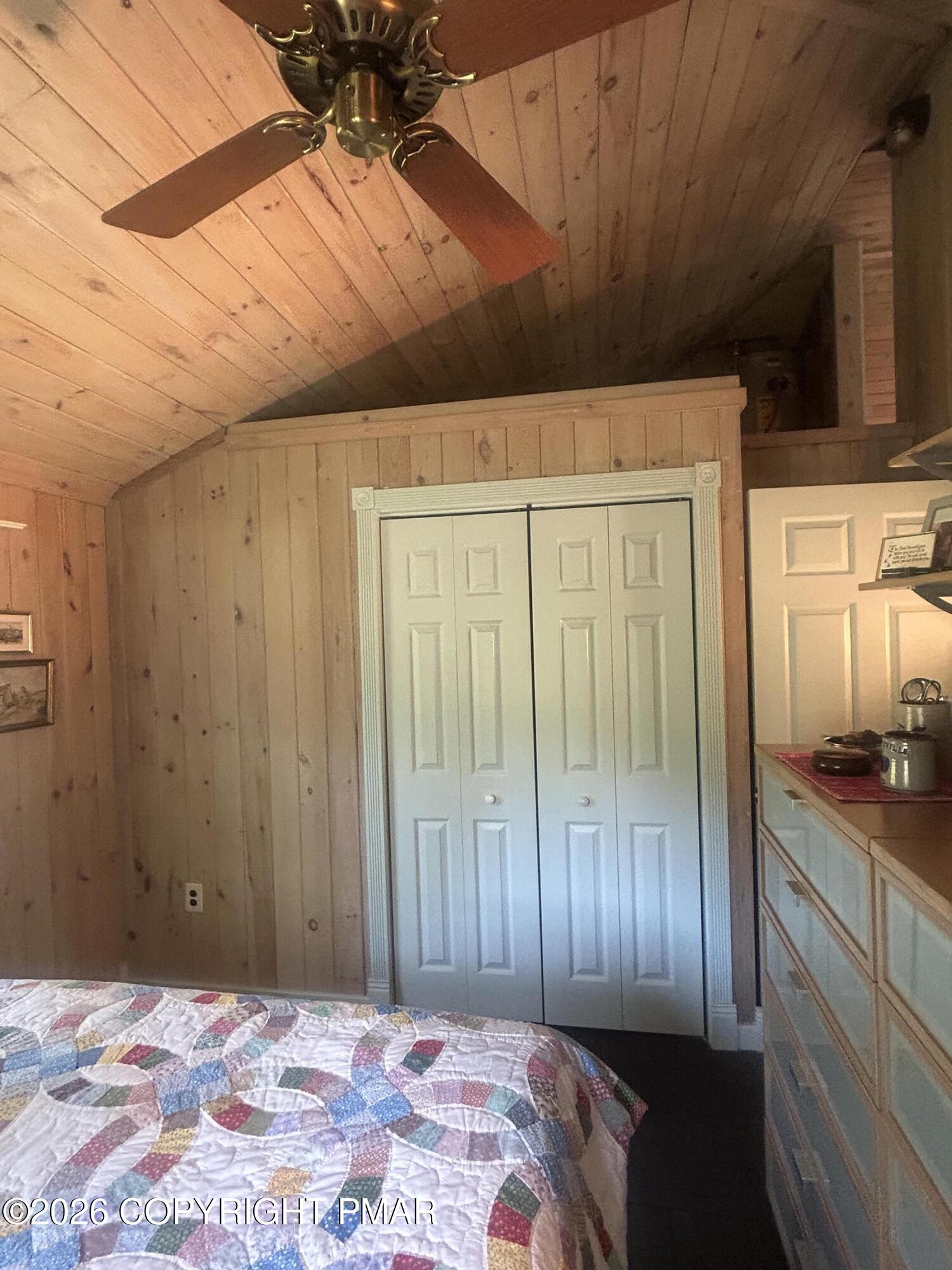 4379 River Road Mount Bethel, PA 18343 - Photo 42 of 48 a bedroom with a bed and a chandelier
