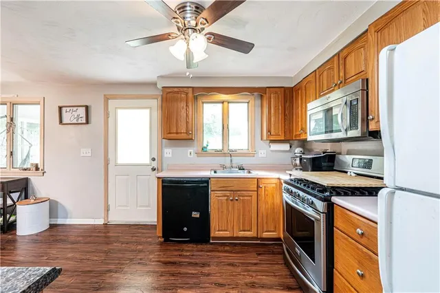a kitchen with stainless steel appliances granite countertop a stove and a sink