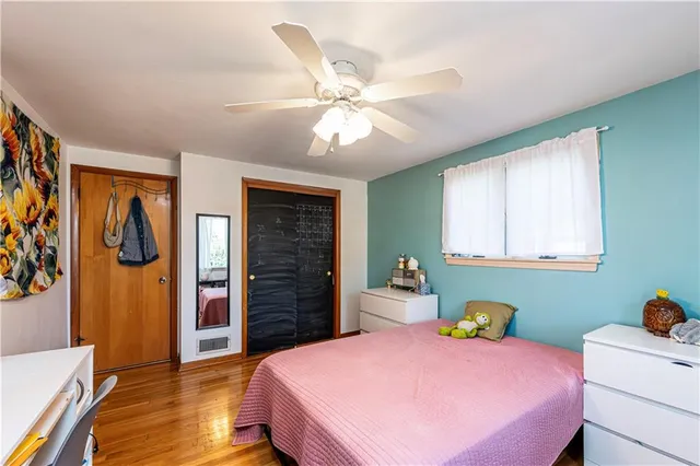 a bed room with a bed and a window