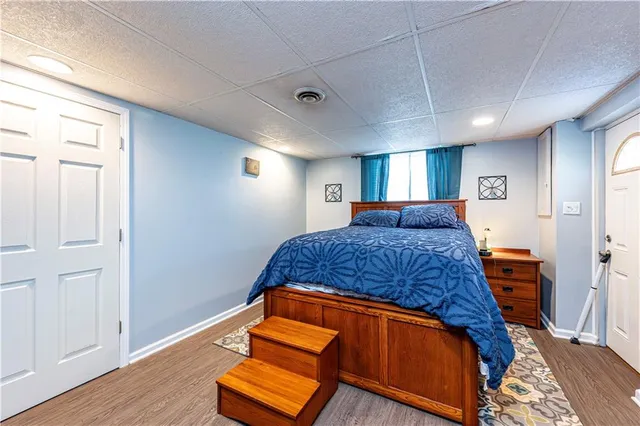 a bedroom with a bed and window