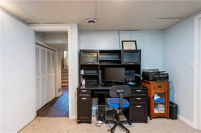 a view of a workspace with furniture