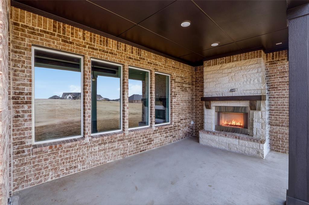 808 Vly Rdg Road Van Alstyne, TX 75495 - Photo 34 of 39 a view of an empty room with a fireplace and a window