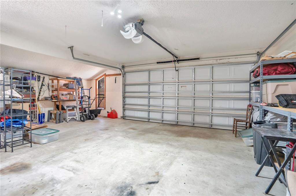 8431 Delaware Drive Weeki Wachee, FL 34607 - Photo 36 of 64 a view of a garage with storage
