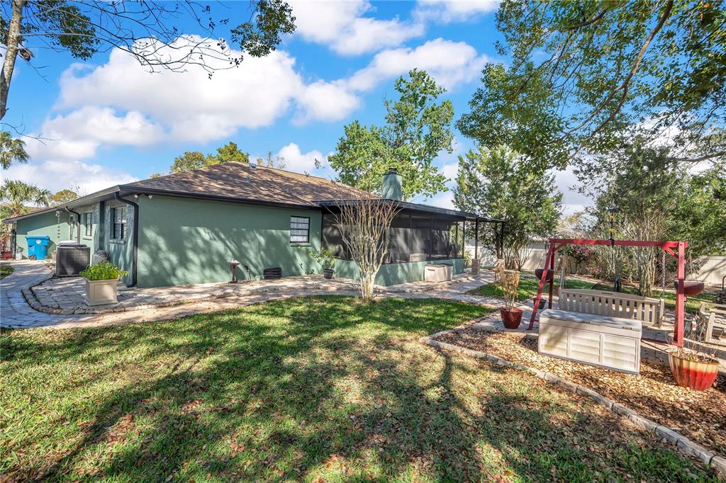 8431 Delaware Drive Weeki Wachee, FL 34607 - Photo 48 of 64 a view of a house with backyard and sitting area