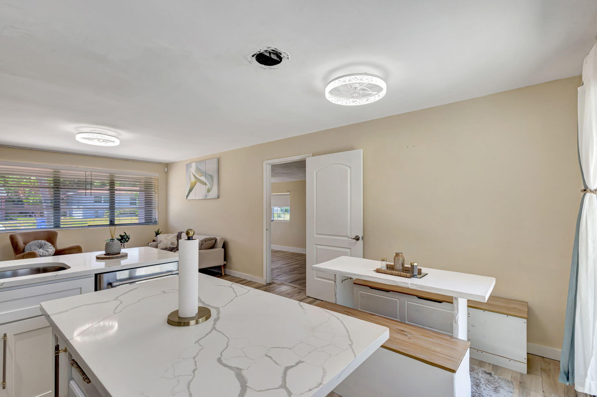 140 West 31st Court Riviera Beach, FL 33404 - Photo 12 of 43 a living room with furniture and wooden floor