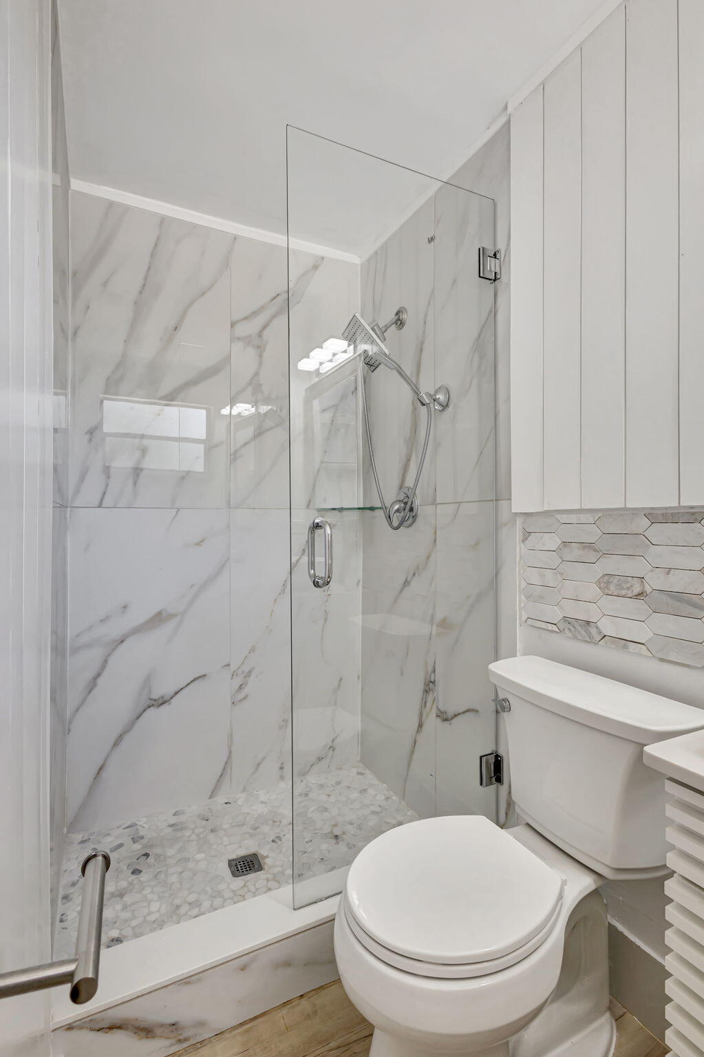 140 West 31st Court Riviera Beach, FL 33404 - Photo 21 of 43 a bathroom with a toilet and a shower