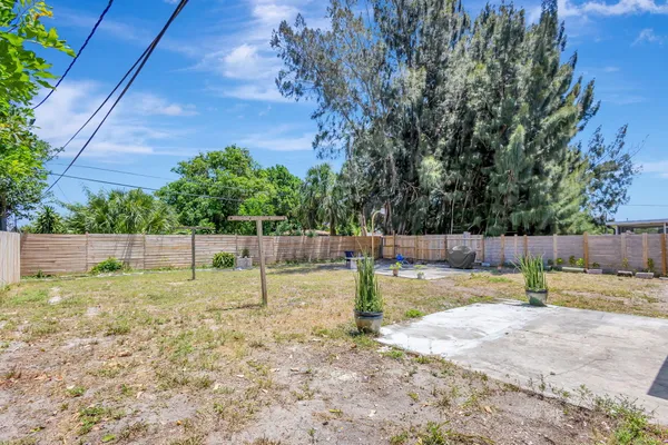 a view of a backyard with swings