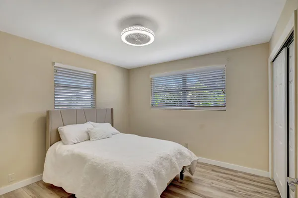 a bed room with a bed and a window