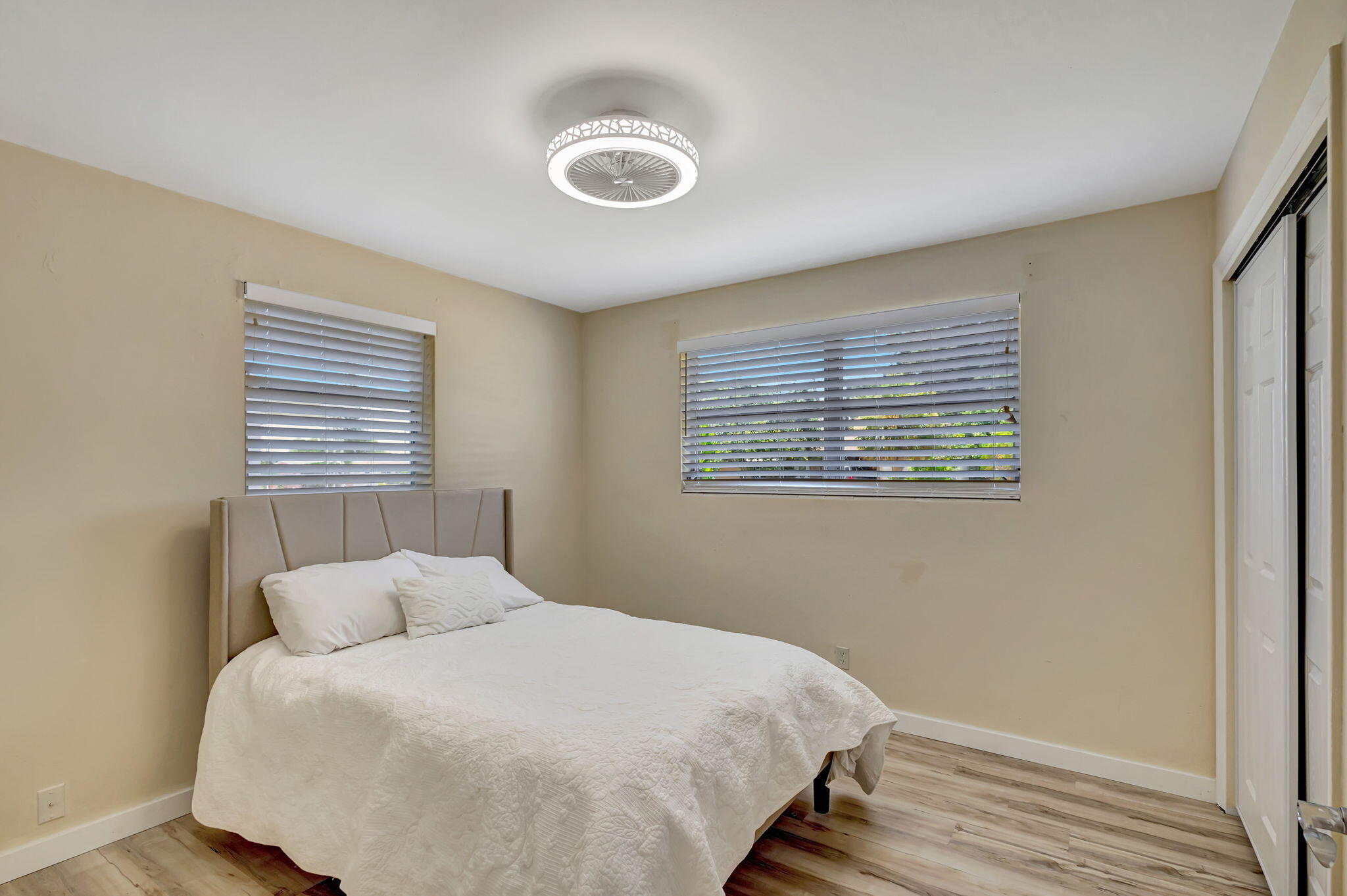 140 West 31st Court Riviera Beach, FL 33404 - Photo 36 of 43 a bed room with a bed and a window