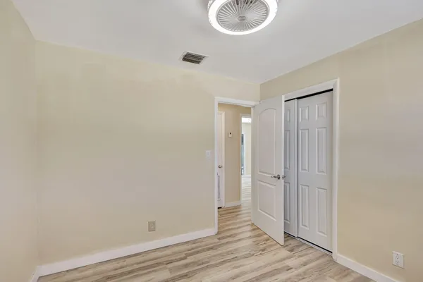 a view of a bathroom with wooden floor