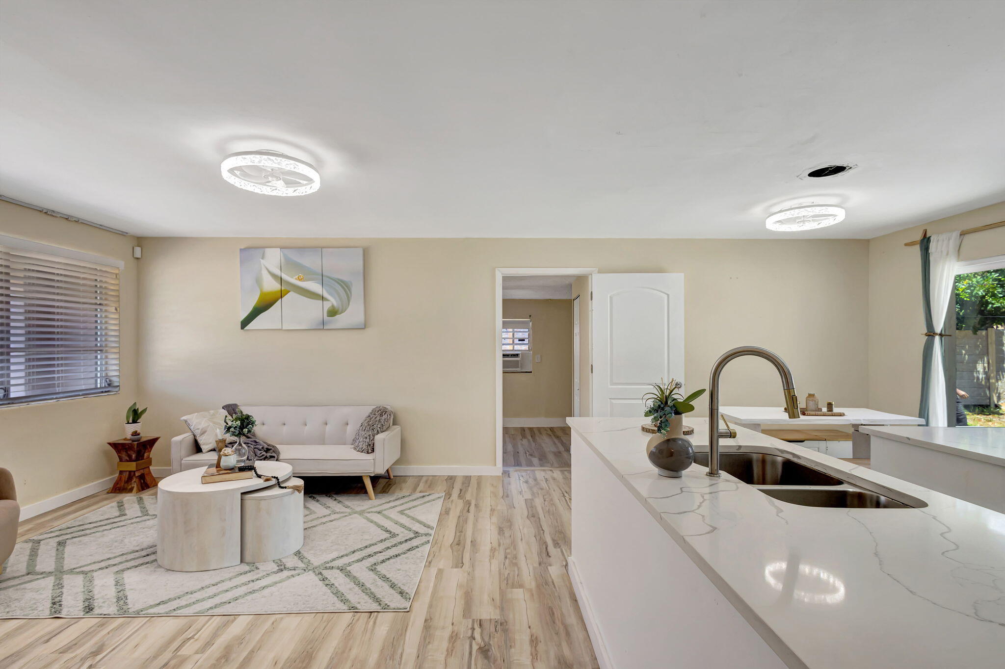 140 West 31st Court Riviera Beach, FL 33404 - Photo 4 of 43 a kitchen with a sink and a stove