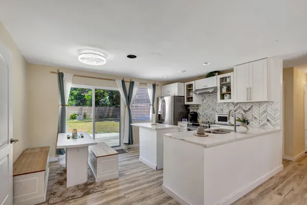 a view of living room with furniture and fireplace