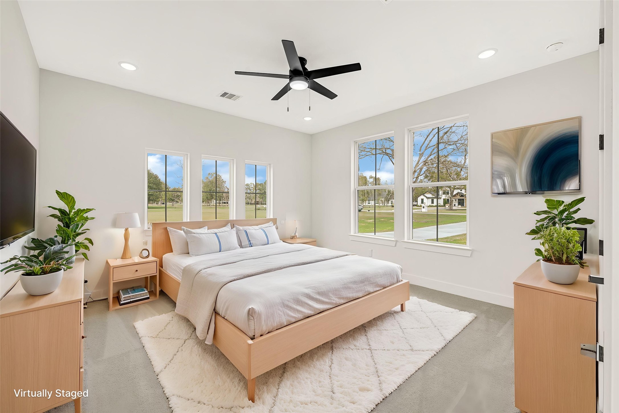 16915 Hamill Drive Rosharon, TX 77583 - Photo 6 of 47 a bedroom with a large bed and a chandelier