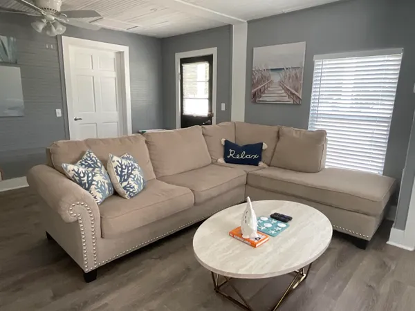 a living room with furniture and a large window