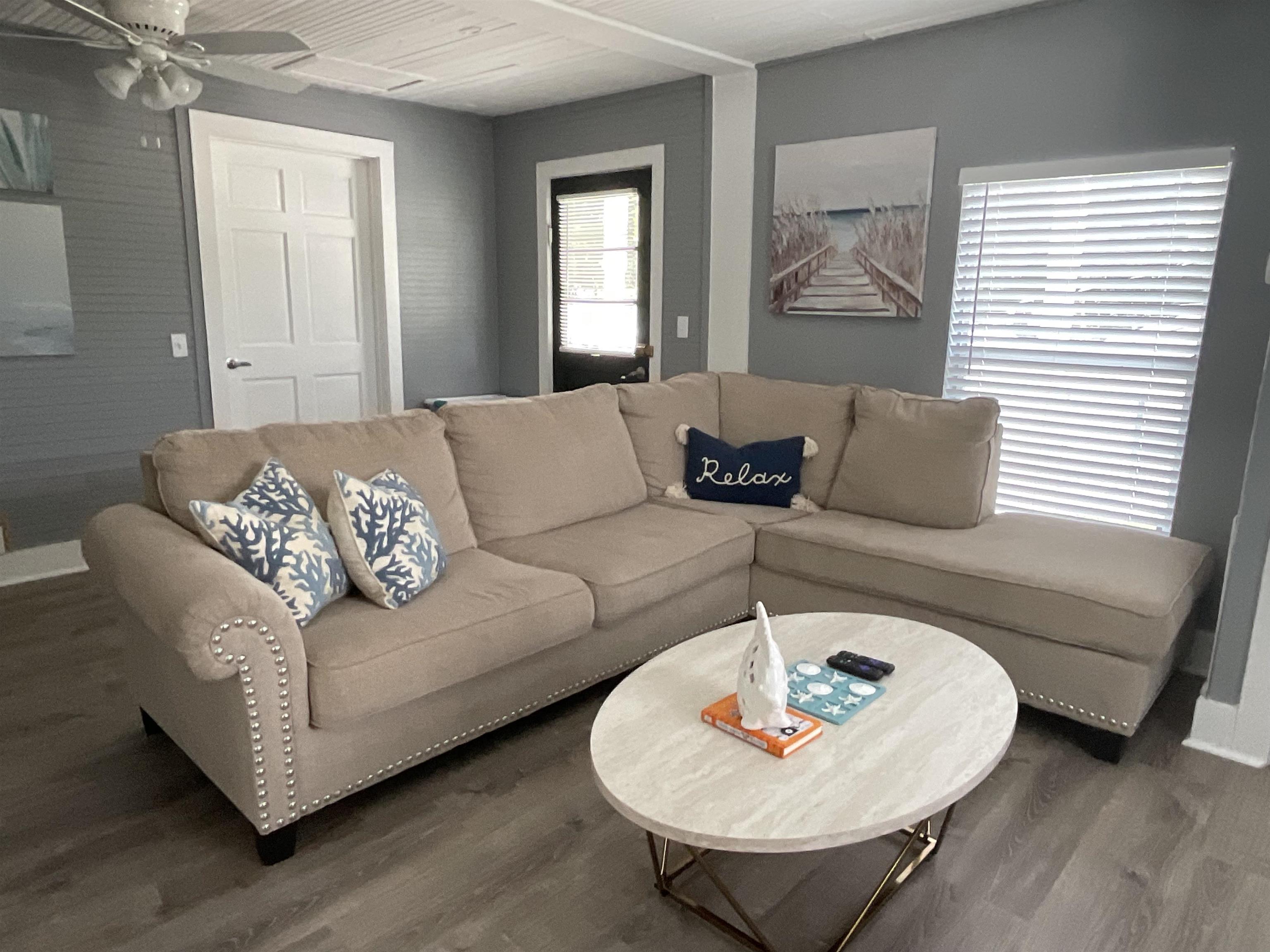 93 Keith Street, Unit B St. Augustine, FL 32084 - Photo 12 of 14 a living room with furniture and a large window