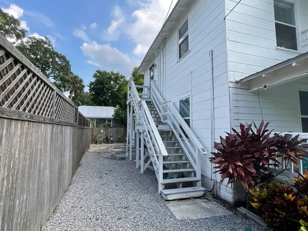 a view of a backyard with sitting area