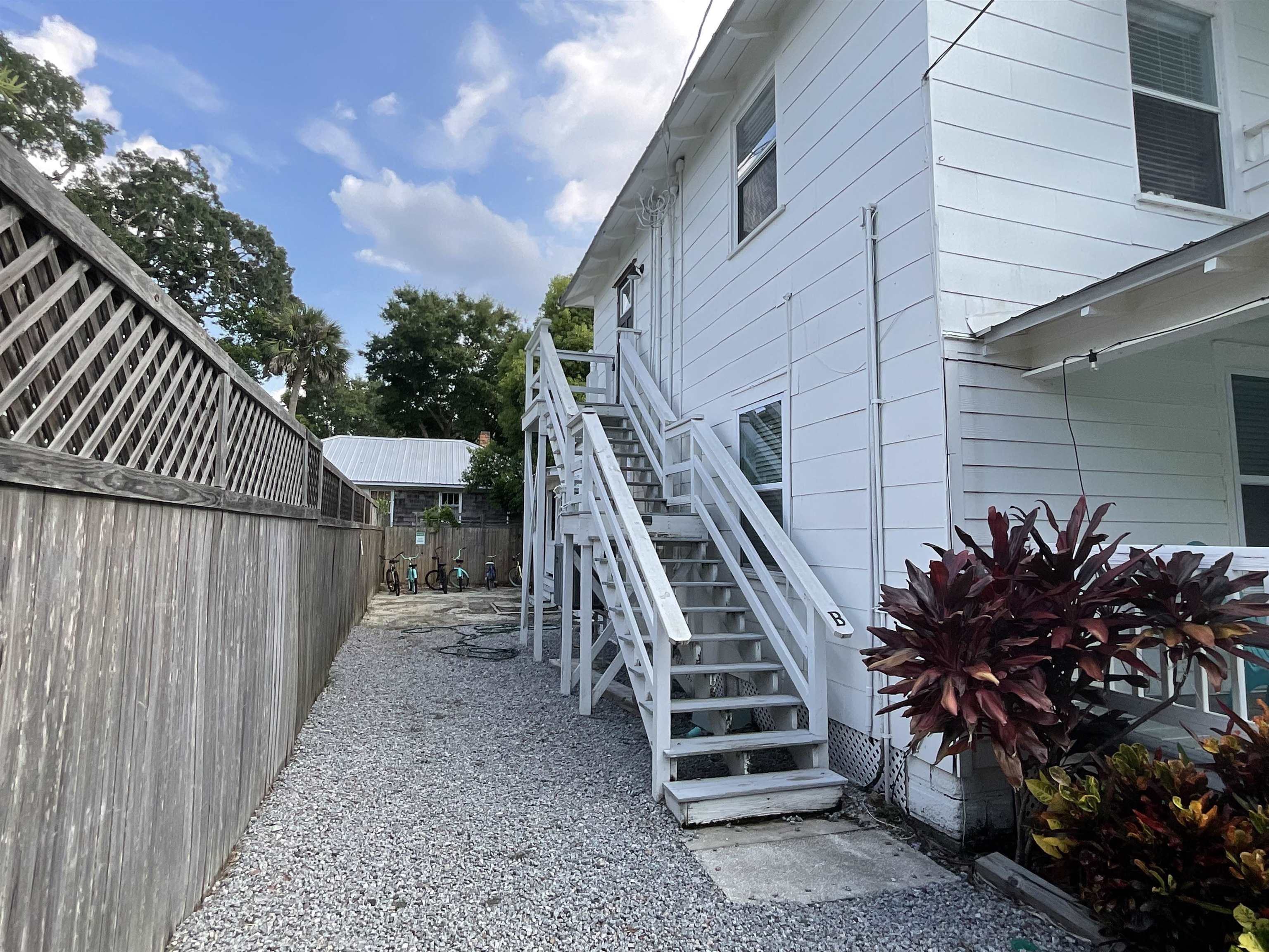 93 Keith Street, Unit B St. Augustine, FL 32084 - Photo 2 of 14 a view of a backyard with sitting area