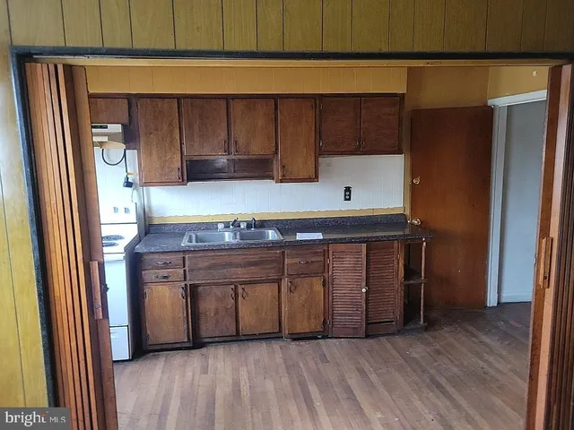a kitchen with stainless steel appliances a refrigerator and a stove