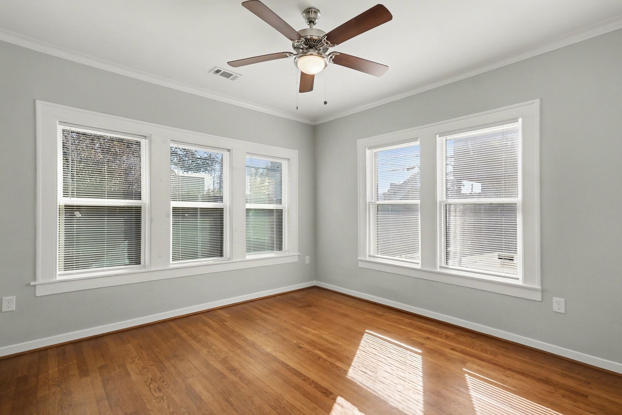 1901 Lexington Street Houston, TX 77098 - Photo 18 of 32 a view of an empty room with a window and wooden floor