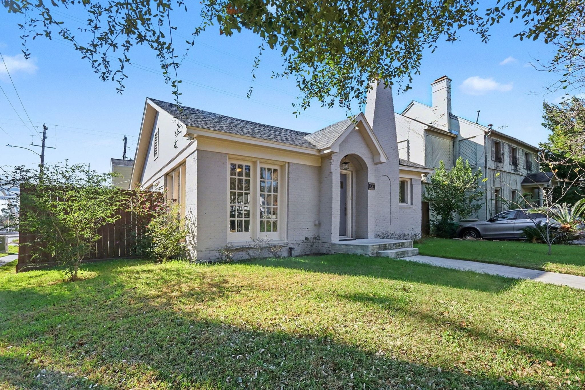 1901 Lexington Street Houston, TX 77098 - Photo 2 of 32 a front view of a house with a yard and garage