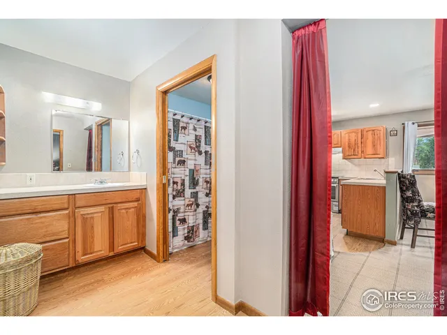 a open kitchen with stainless steel appliances granite countertop a refrigerator and a sink