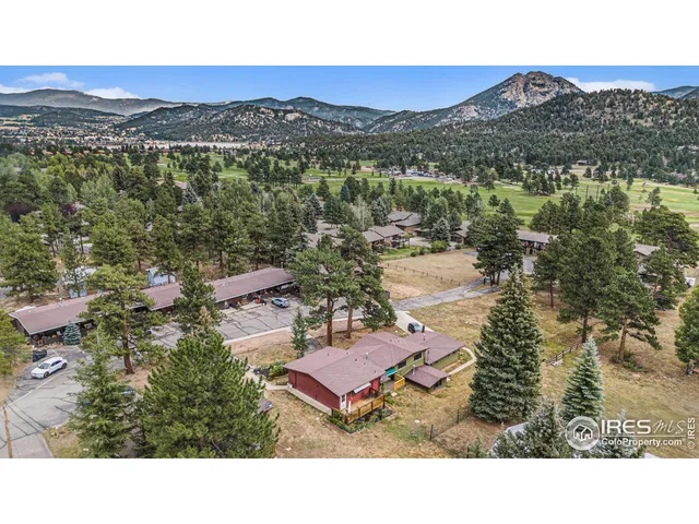 a view of a city with mountains in the background