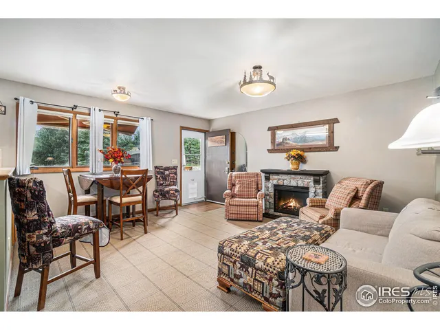 a living room with furniture a dining table and a piano table