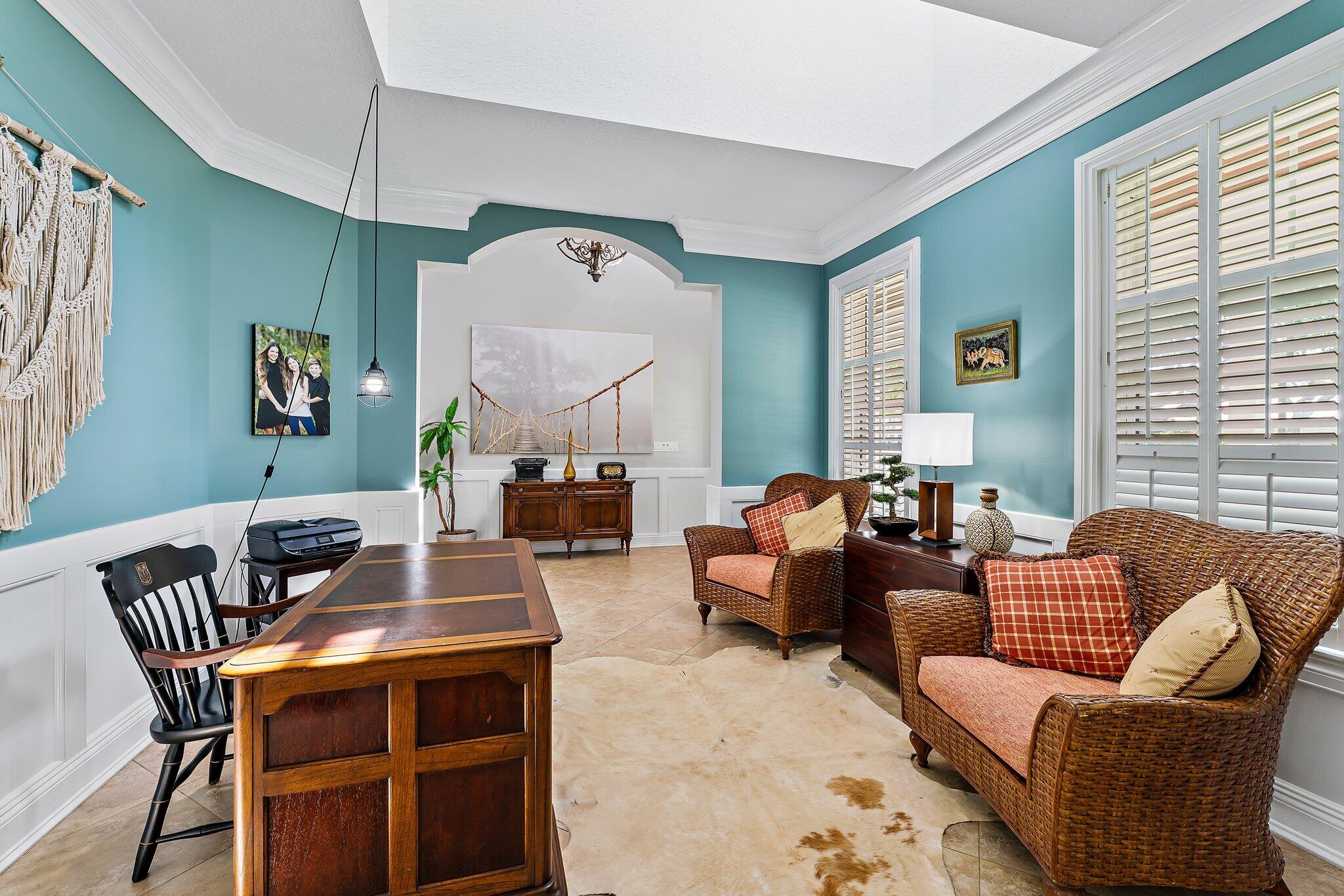 18263 River Oaks Drive Jupiter, FL 33458 - Photo 11 of 49 a living room with furniture and a potted plant