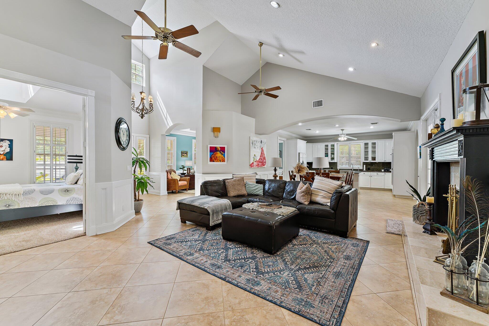 18263 River Oaks Drive Jupiter, FL 33458 - Photo 15 of 49 a living room with furniture and a flat screen tv