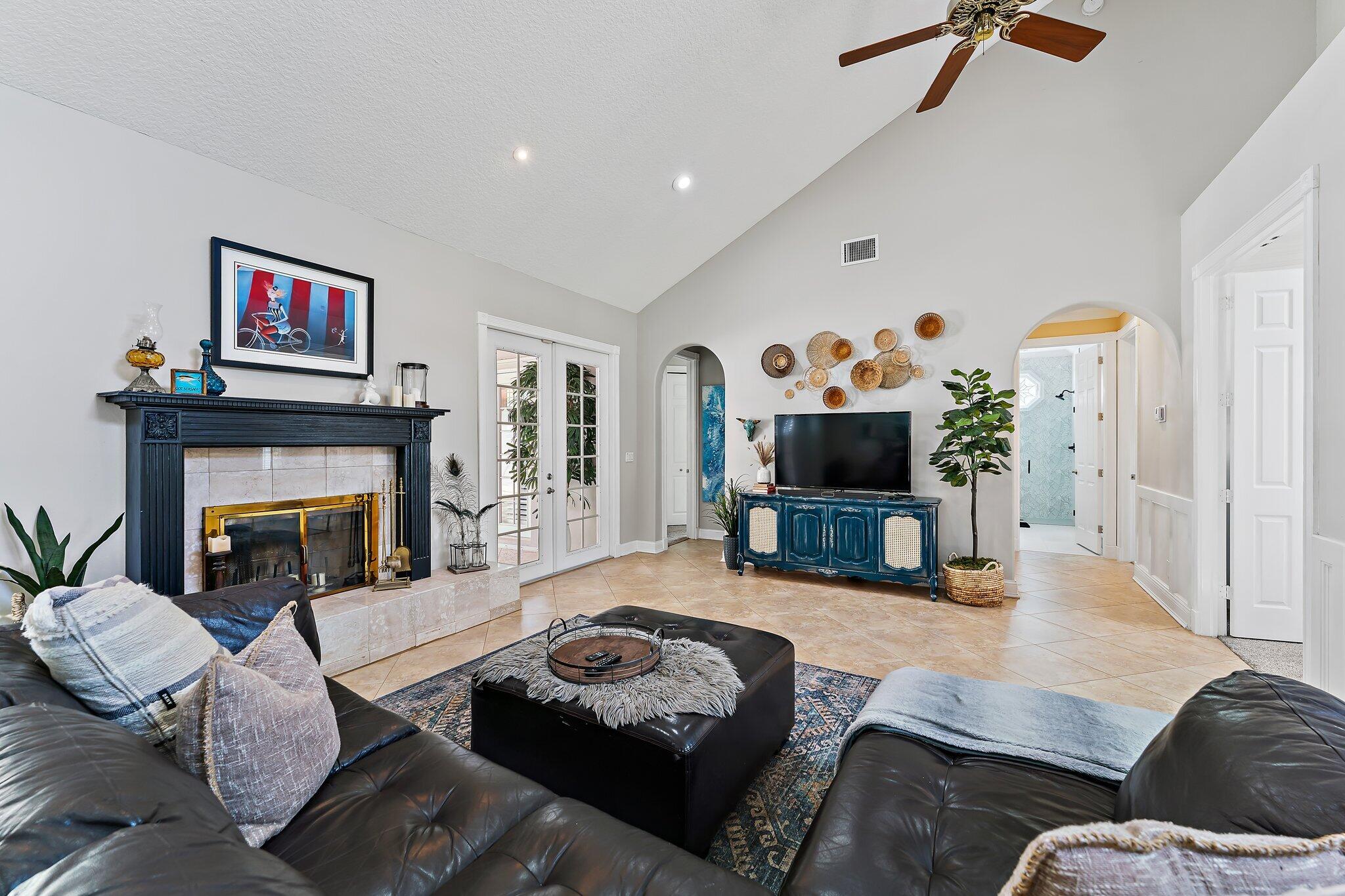 18263 River Oaks Drive Jupiter, FL 33458 - Photo 17 of 49 a living room with furniture and a fireplace