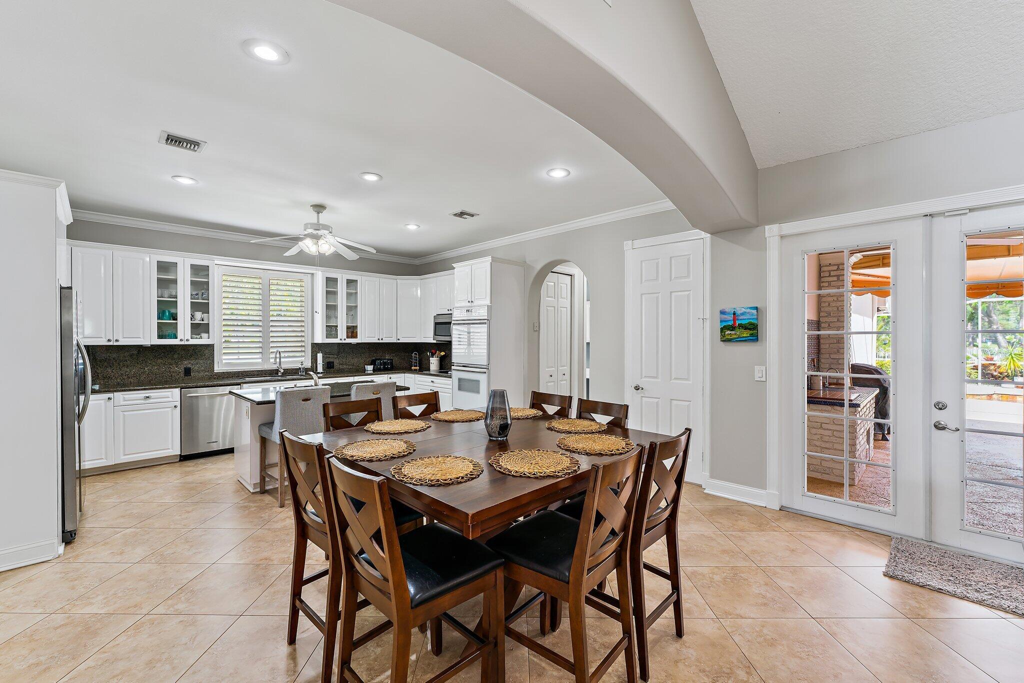 18263 River Oaks Drive Jupiter, FL 33458 - Photo 18 of 49 a dining room with furniture and window